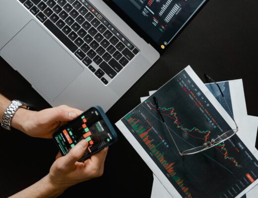 hands holding a smartphone with data on screen