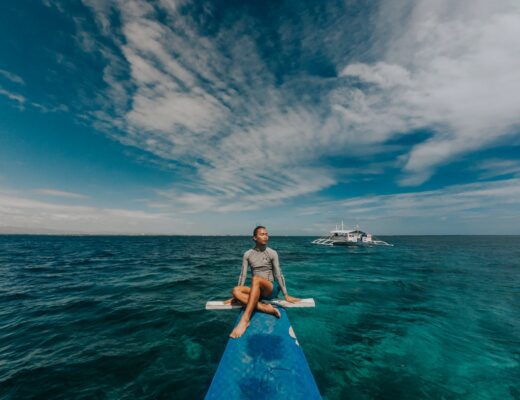 photo of man wearing rash guard