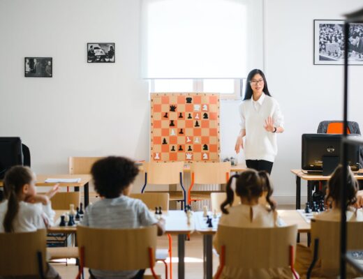 a woman standing in front of young children