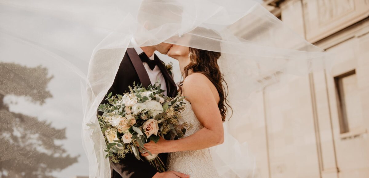 man and woman kissing