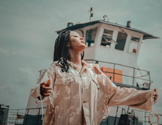 woman standing near white ship