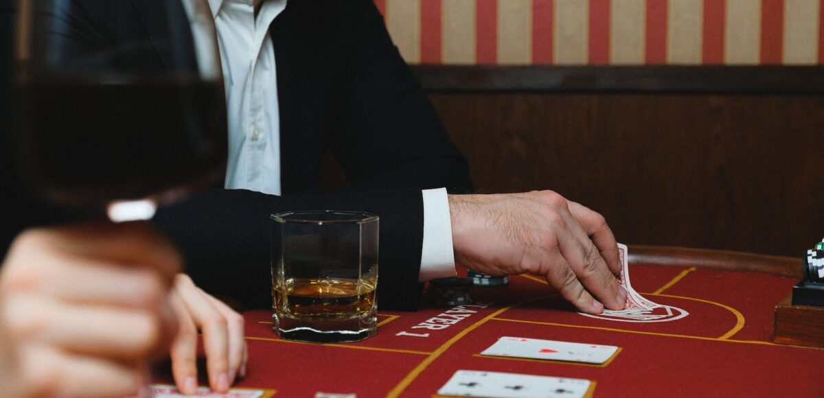 man in black suit jacket playing poker in a casino