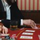 man in black suit jacket playing poker in a casino