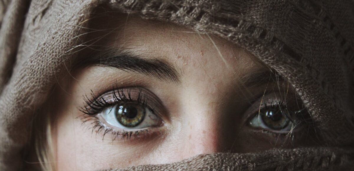 photo of person covered with brown textile