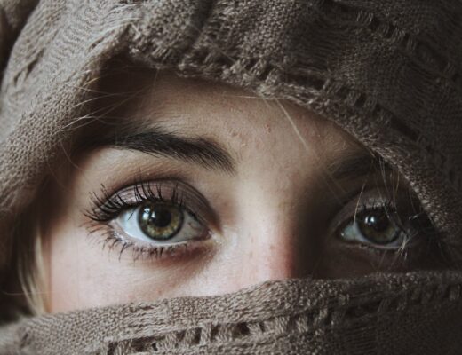 photo of person covered with brown textile