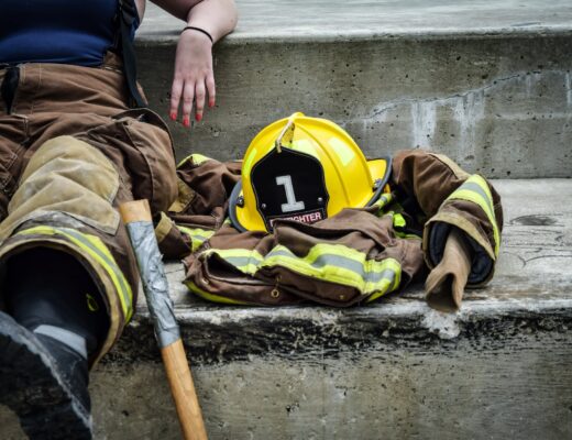 yellow hard hat on brown and yellow fireman s suit