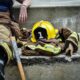 yellow hard hat on brown and yellow fireman s suit