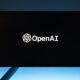 monitor screen with openai logo on black background