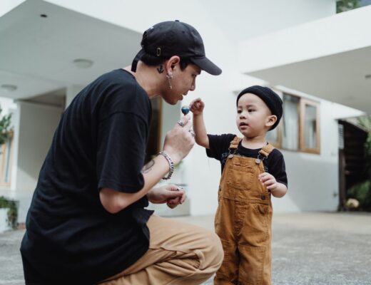 father negotiating lollipop with son