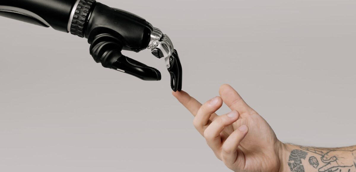 bionic hand and human hand finger pointing