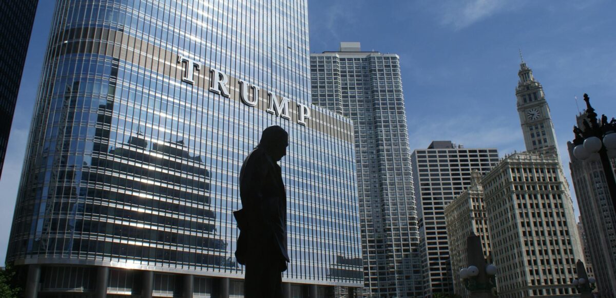 silhouette of statue near trump building at daytime