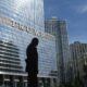 silhouette of statue near trump building at daytime