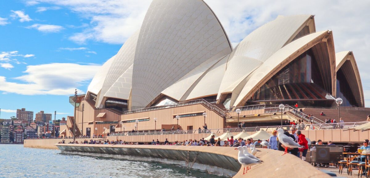 people gathering outside sydney opera house