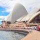 people gathering outside sydney opera house