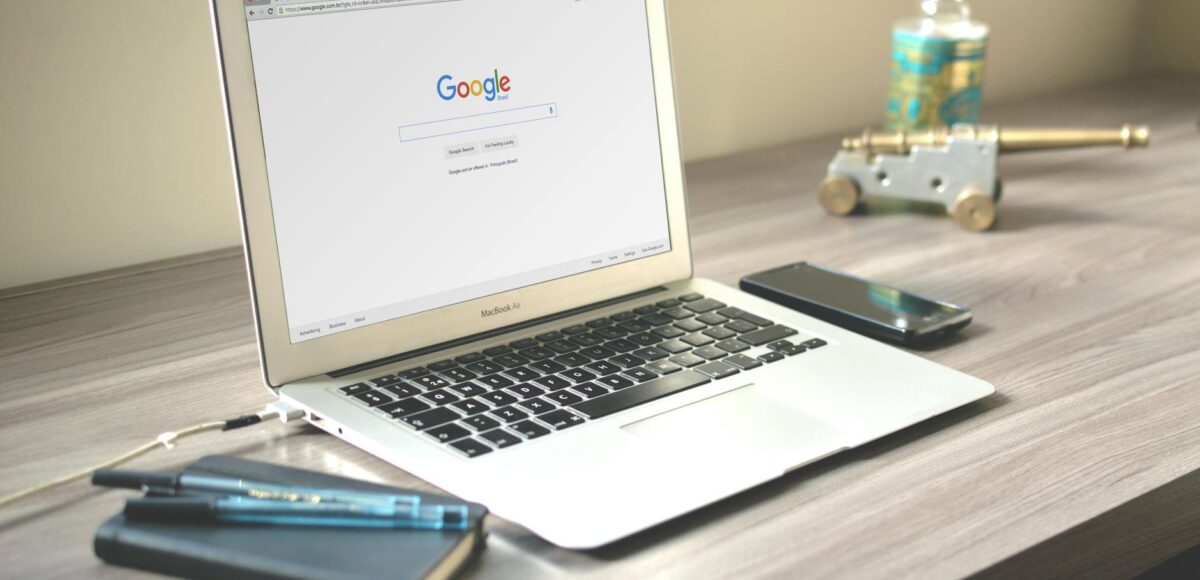 macbook air on grey wooden table