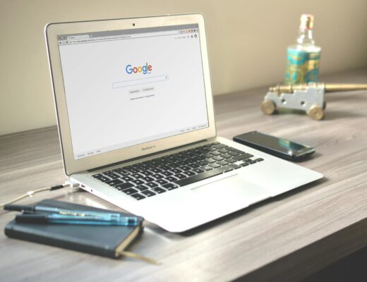 macbook air on grey wooden table