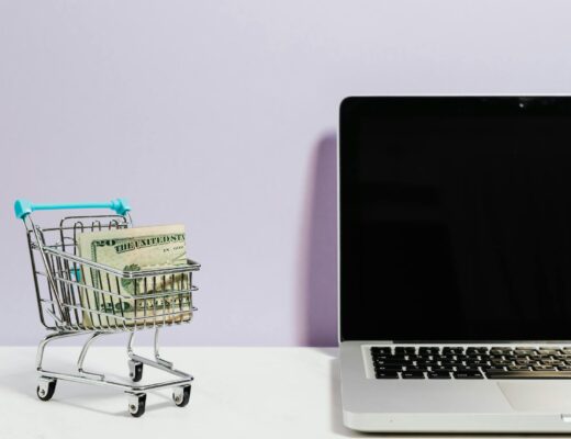 shopping cart next to a laptop